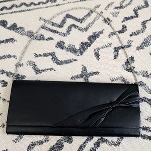 Vintage leather clutch with metal strap